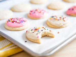 Homemade lofthouse cookies on a baking sheet.