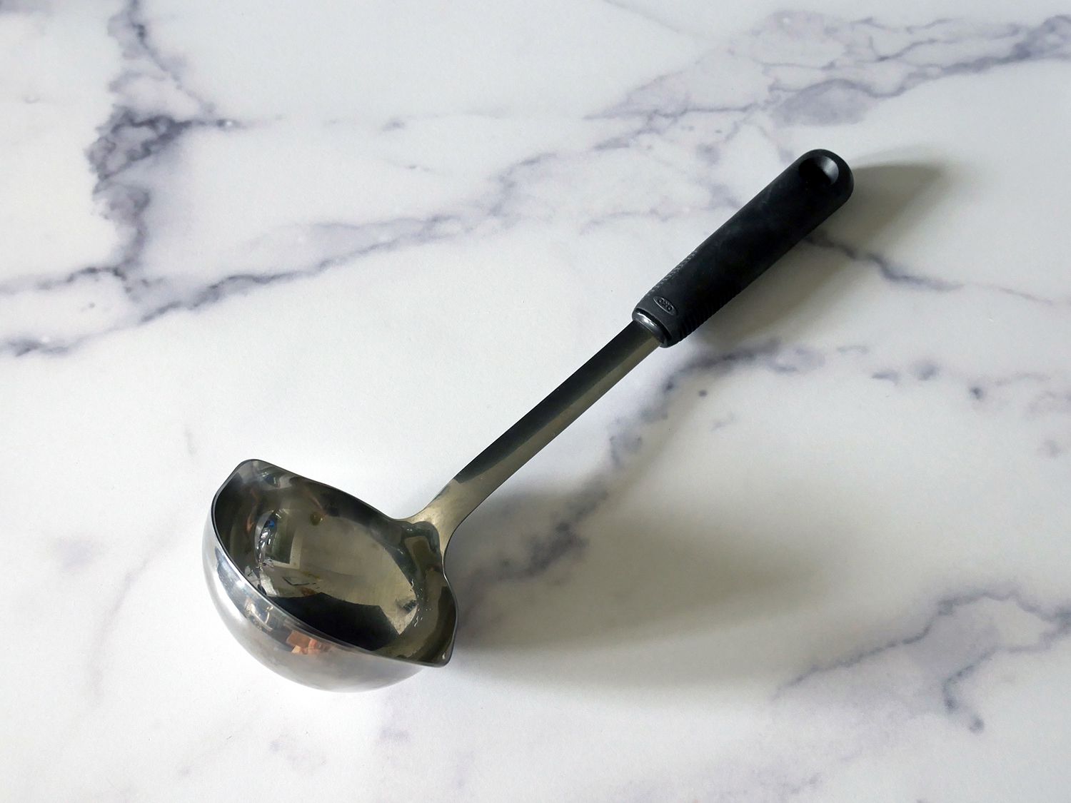 the oxo ladle on a marble countertop