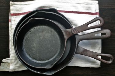 Three Cast Iron Skillets stacked inside each other.