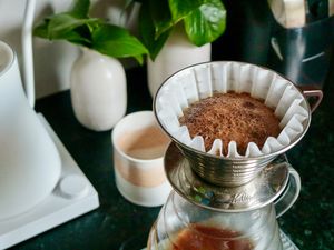 coffee being bloomed in a Kalita Wave 185