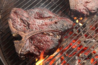 A grilled ribeye on the grill