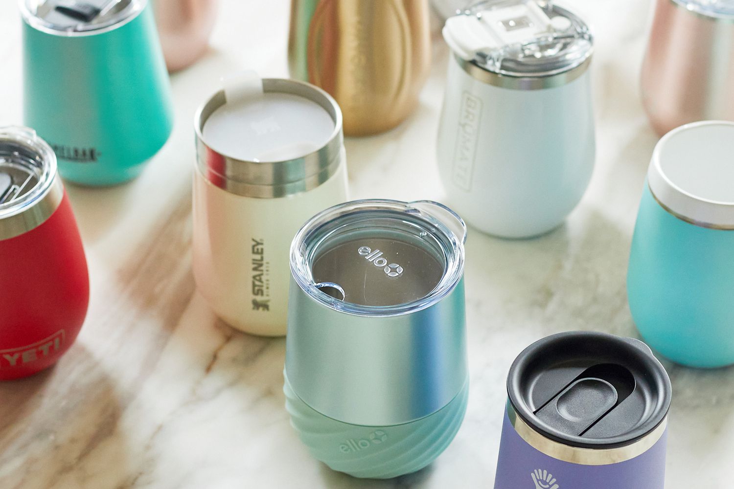 several wine tumblers on a marble surface