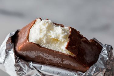 A homemade Klondike Bar with a bite taken out of it.