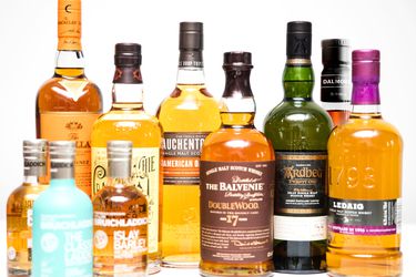 An assortment of bottles of single malt scotches.