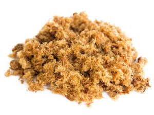A pile of pork floss resting on a white surface