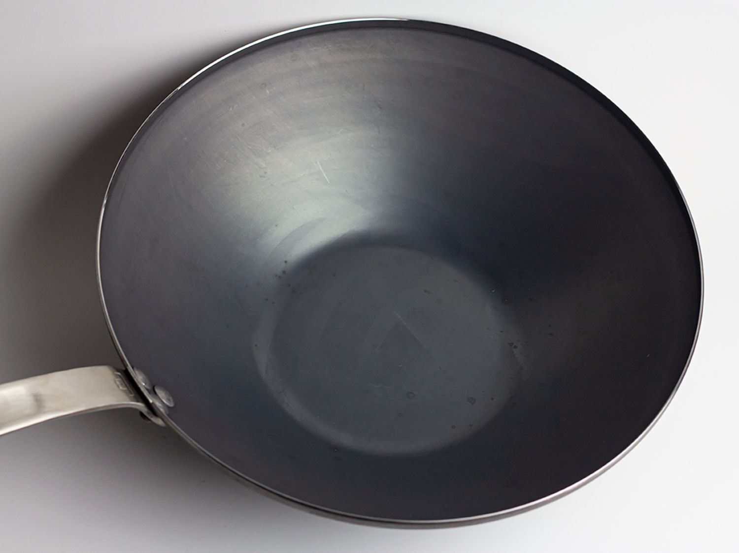A blue carbon steel wok from Made In.