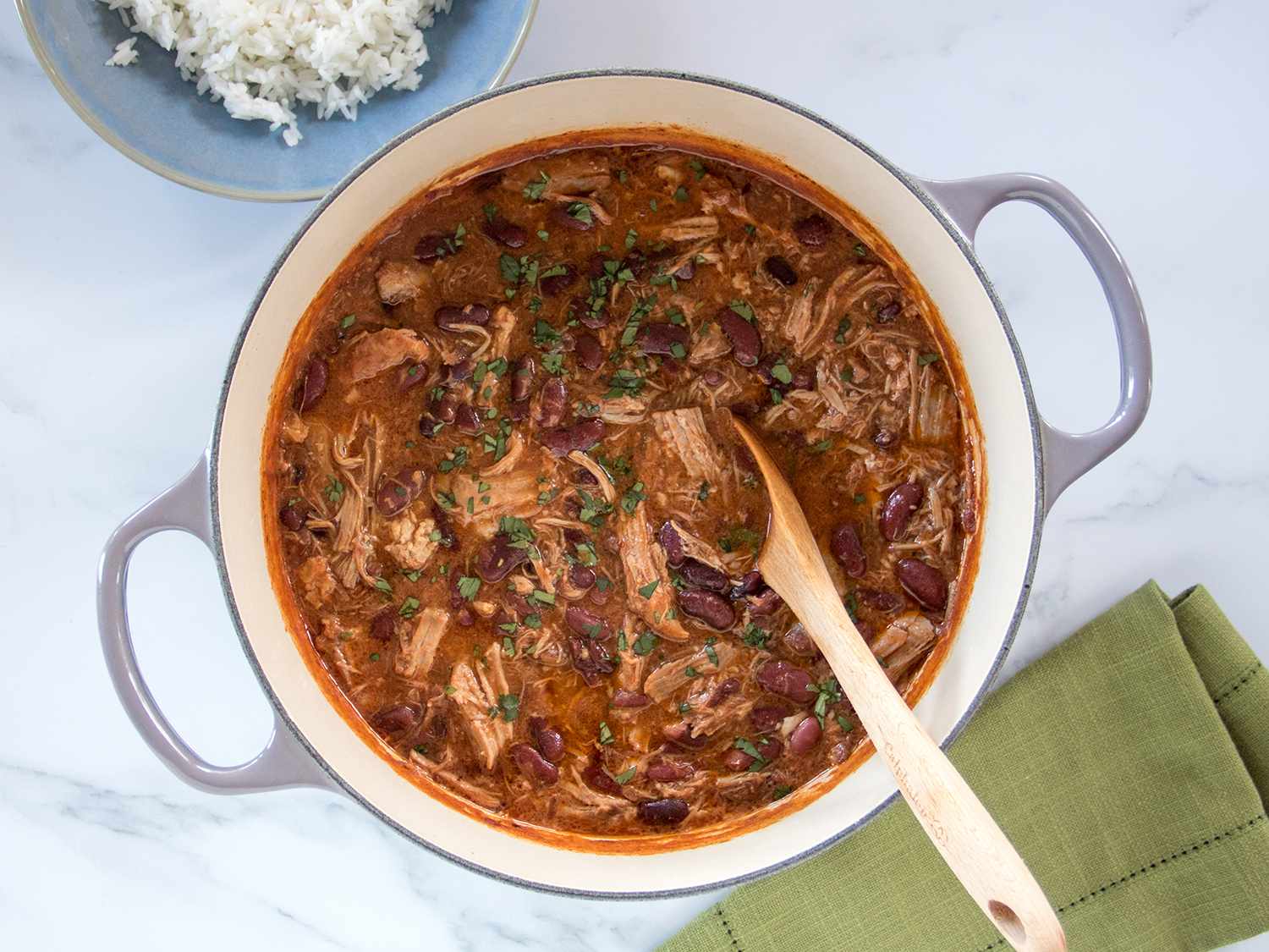 Pork and beans in a Dutch oven.