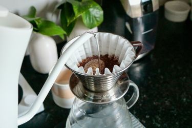 水being poured in a pourover brewer