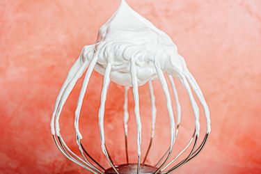 Meringue on pink background