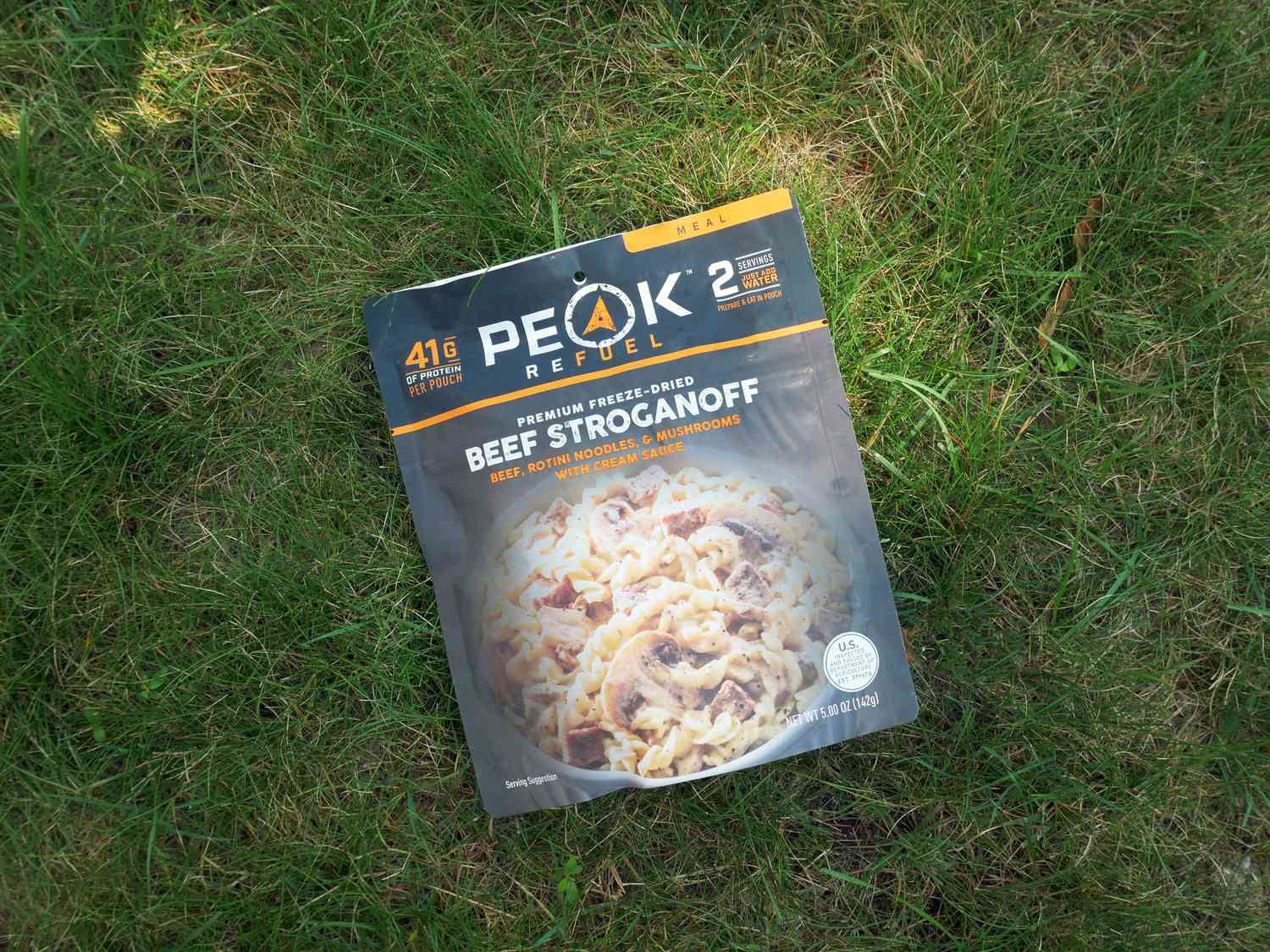Peak refuel beef stroganoff pouch on lawn