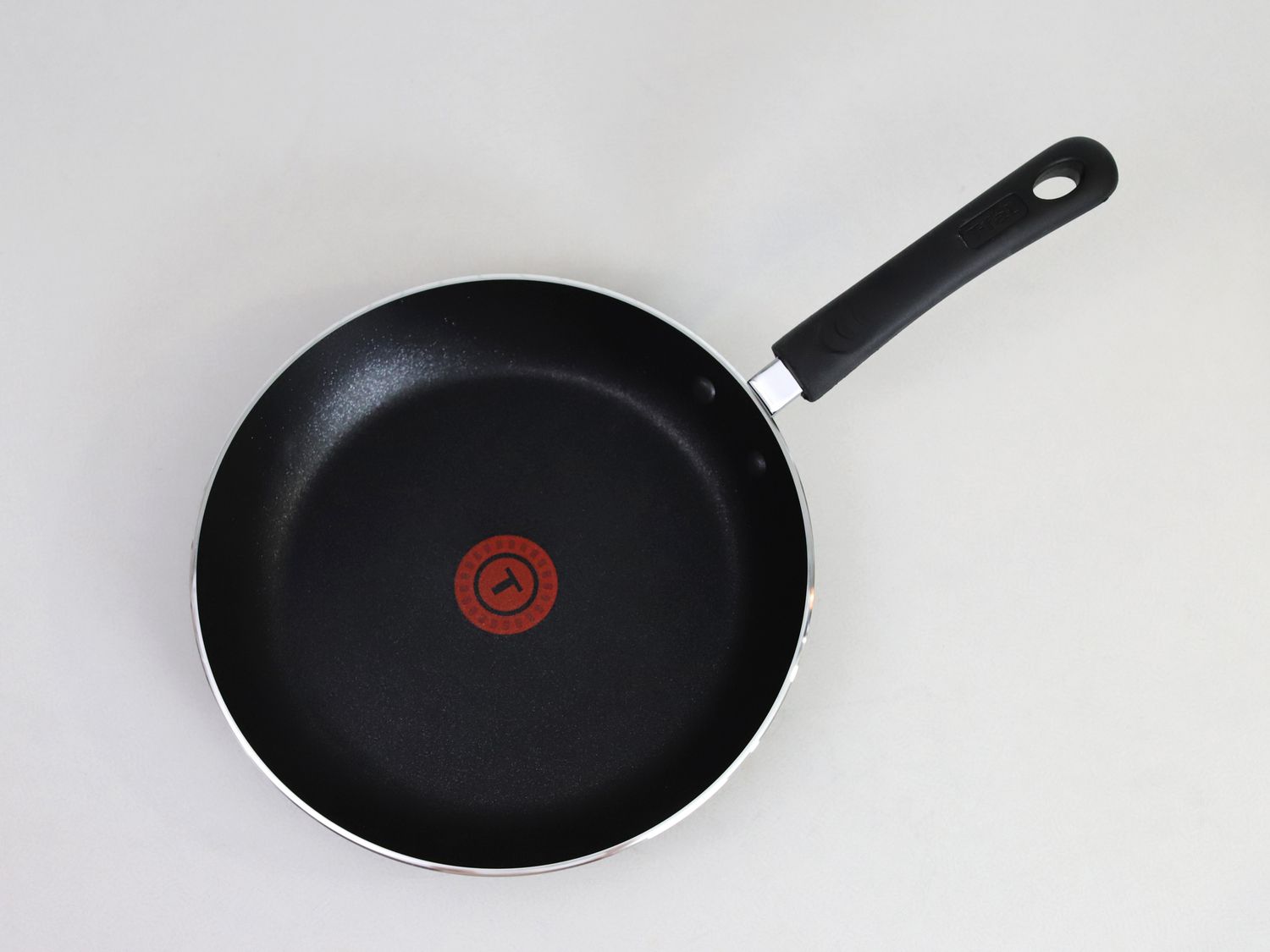an overhead look at the T-fal nontick skillet sitting on a white surface
