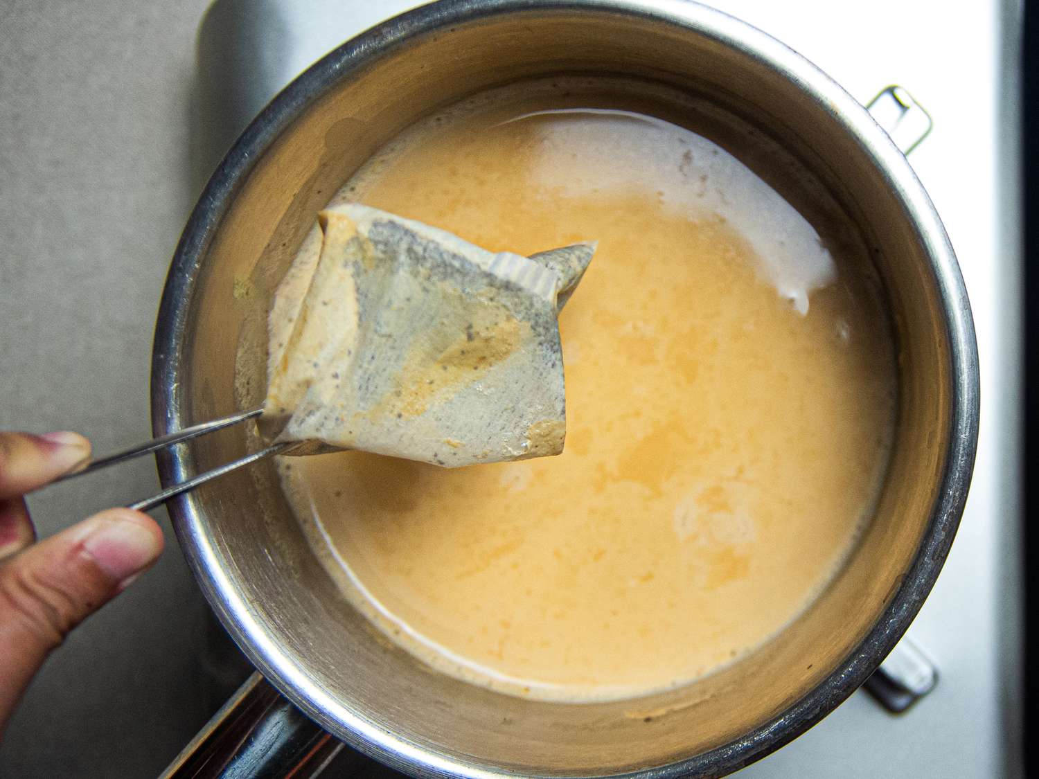 Overhead view of removing tea bag