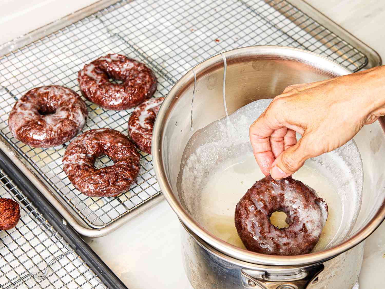 Overhead photo of glazing donuts