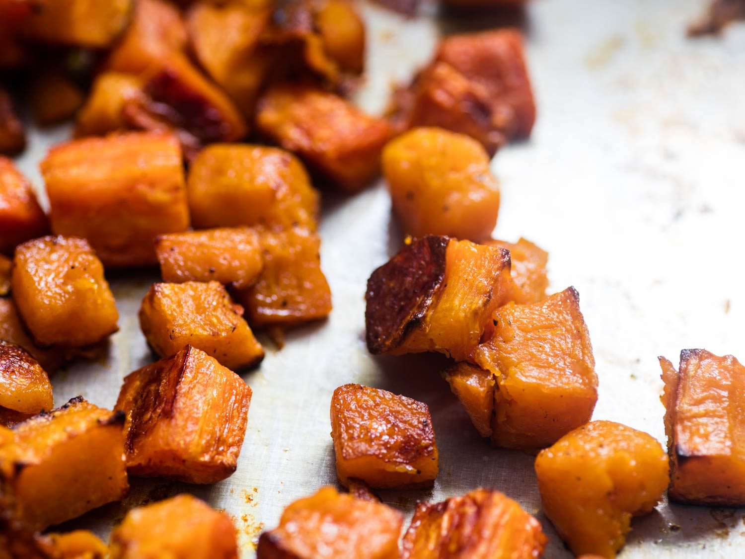 Close up of roasted squash pieces.