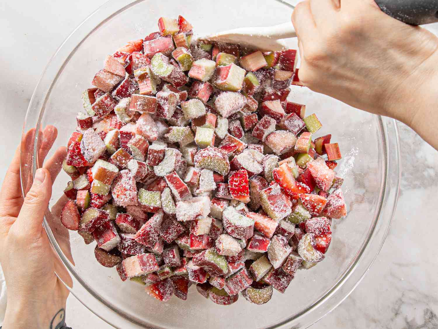 Tossing fruit with sugar