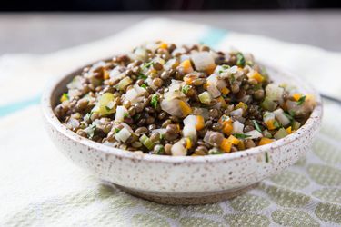 A bowl of simply-prepared French lentils with aromatics