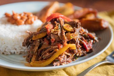 Cuban shredded beef plated with rice, beans. and plantains