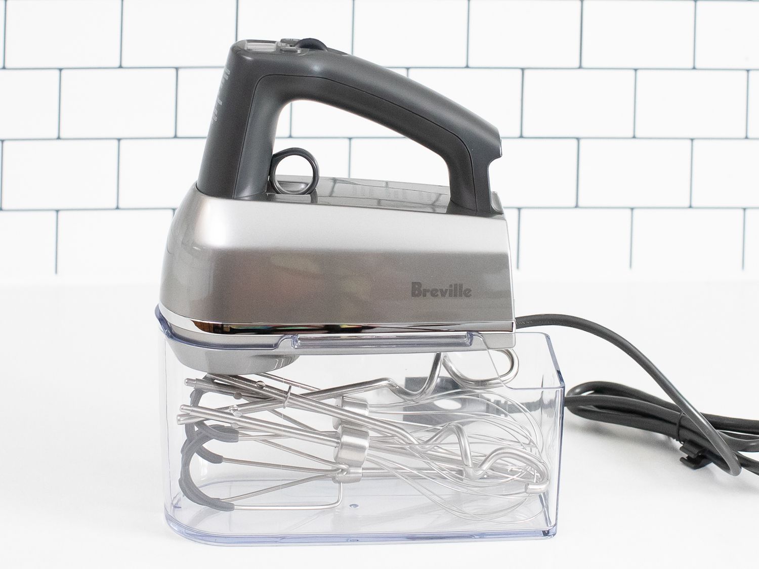 a Breville Hand Mixer on a white kitchen countertop