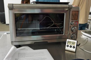 Heat thermometer testing temperature of a Breville Smart Oven Air Fryer