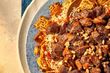 Overhead view of a half of dish of Egyptian fatta