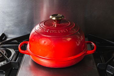 a red Le Creuset bread oven
