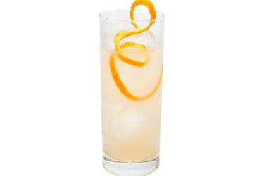 The Number 8, a ginger liqueur-based cocktail in a Collins glass with a long twist of grapefruit peel.