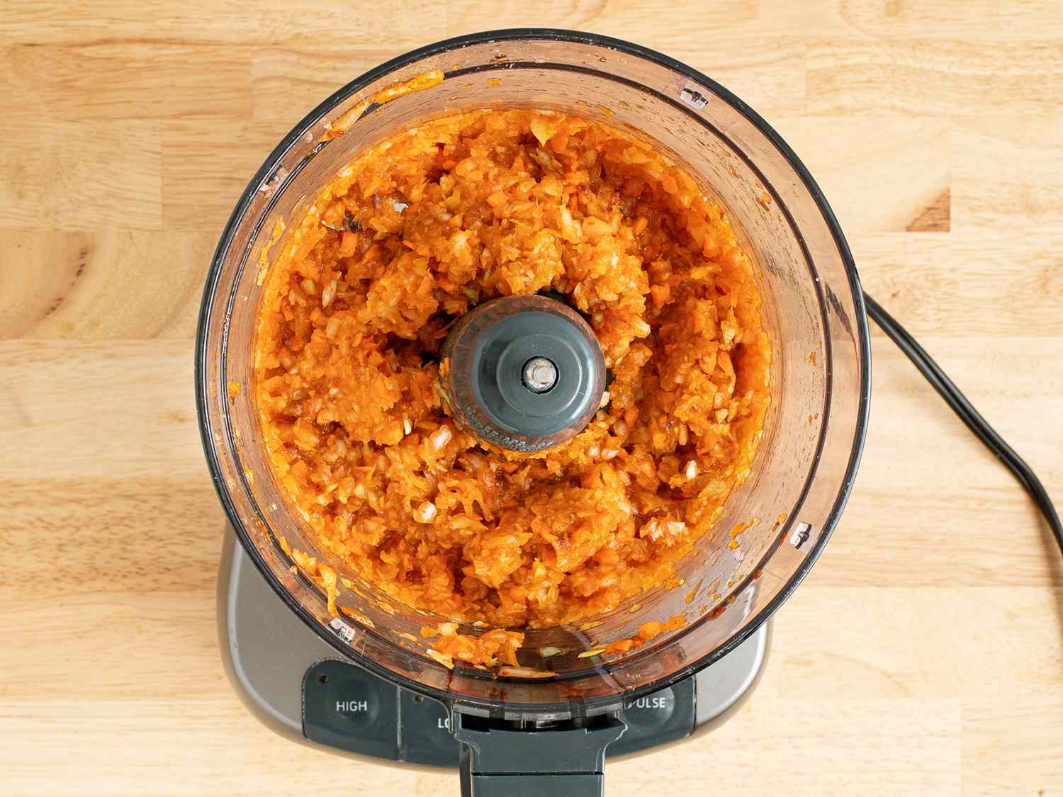 Processed vegetables and spices in a food processor