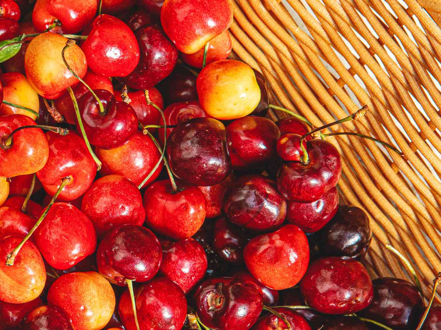 Overhead view of cherries in a basket