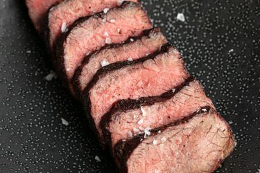 close up of grilled short ribs cut into slices