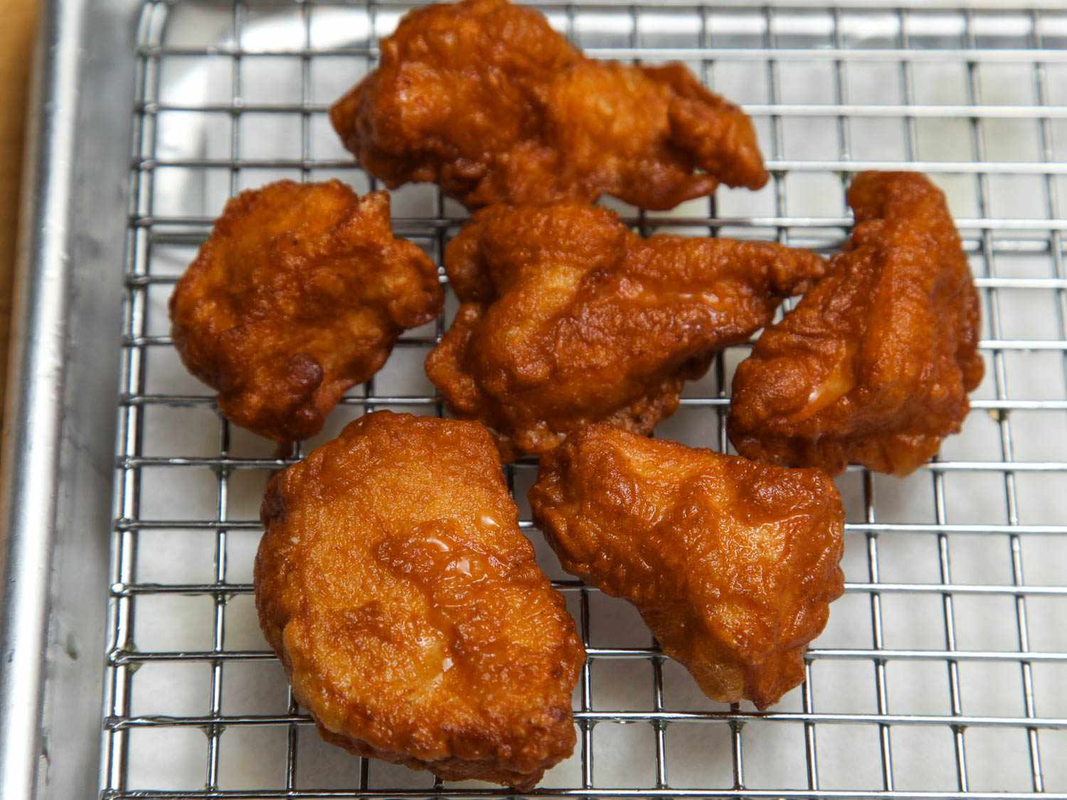 Boneless chicken thighs coated in egg-and-cornstarch batter and fried.