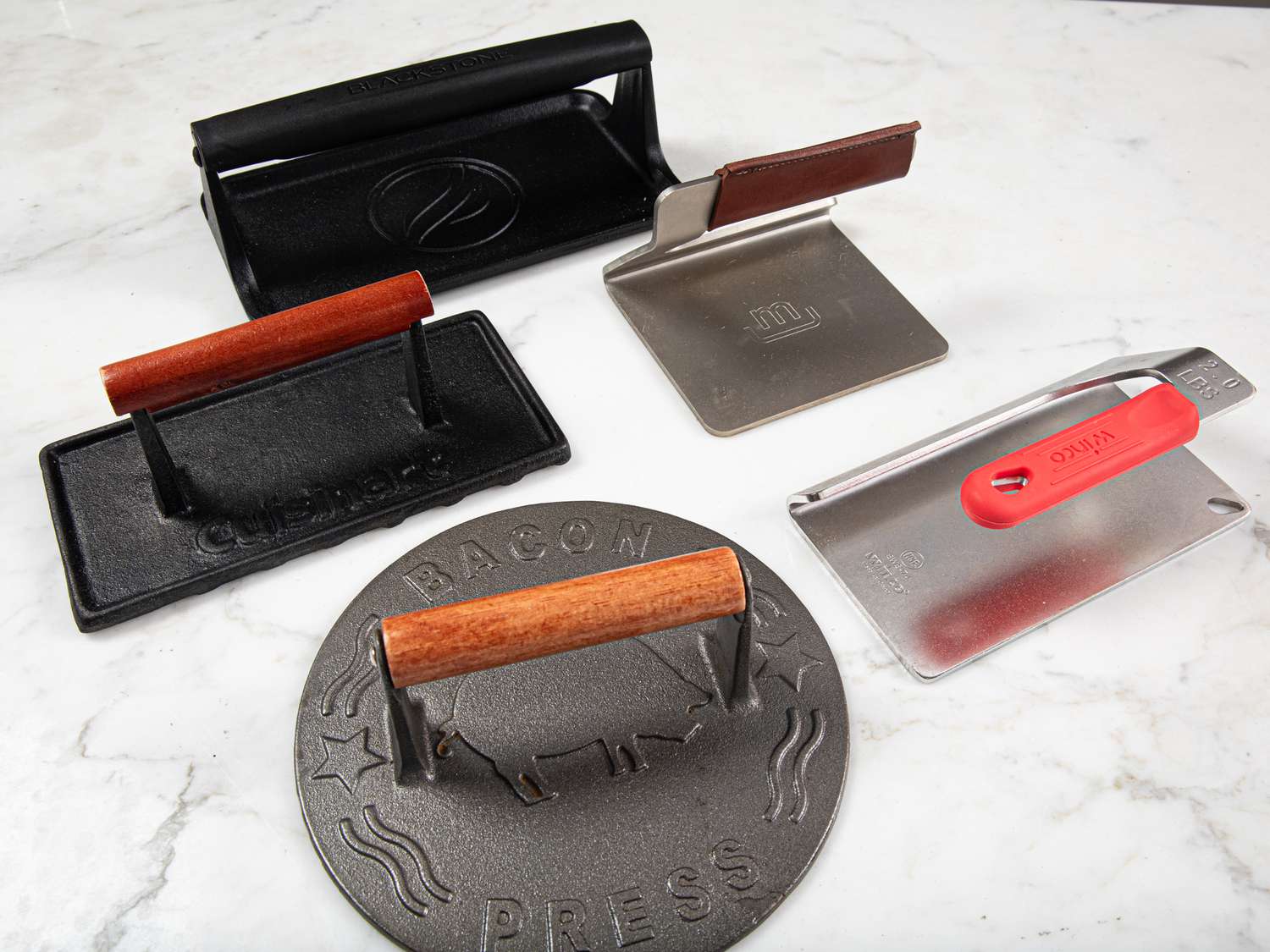 our five winning grill presses on a marble countertop