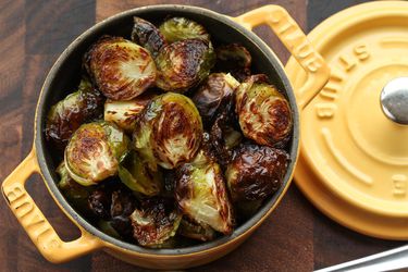 Caramelized roasted brussels sprouts presented in Dutch oven