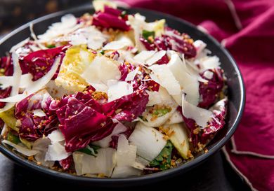 A hearty salad of radicchio, endive, and anchovies topped with shaved Parmigiano-Reggiano.