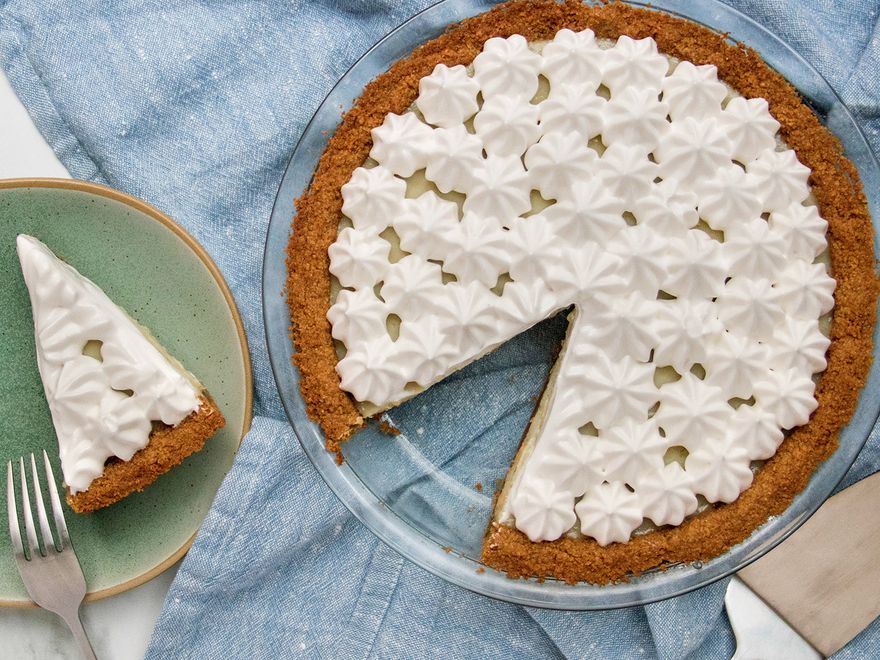 Vegan Key lime pie with one slice removed (slice is alongside on a plate)