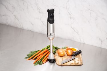 Vitamix Immersion Blender on Counter with carrotts, onions, and cutting board
