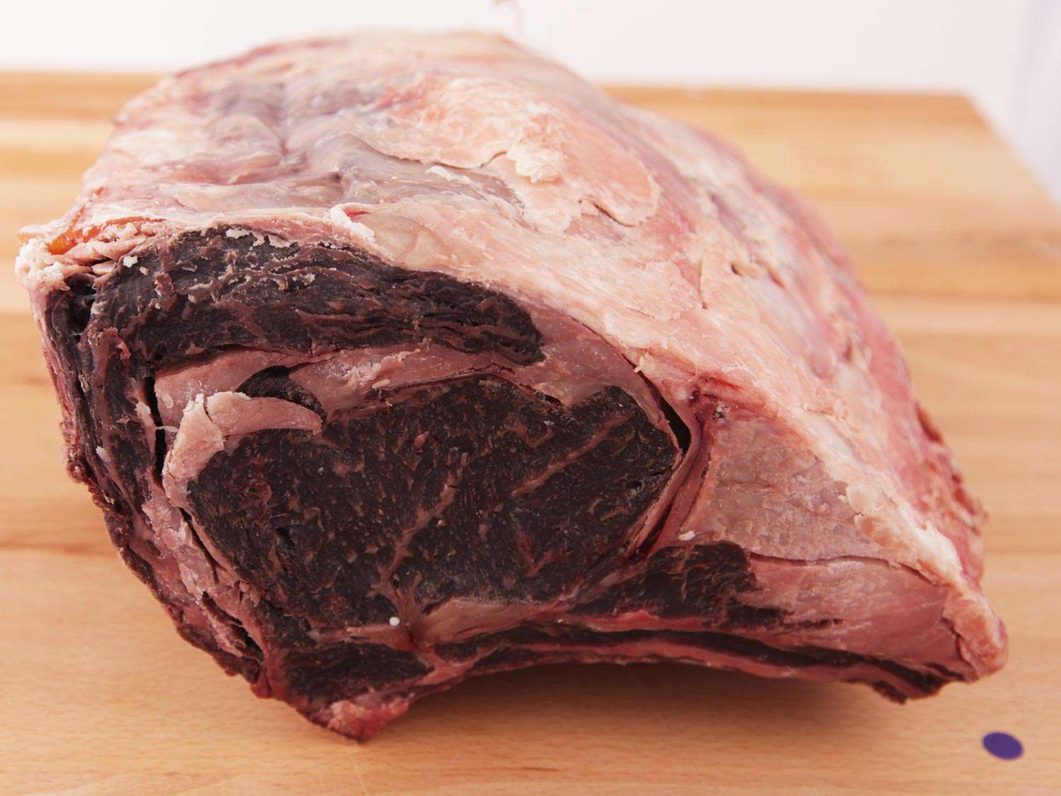 Dry-aged steak on a wooden surface