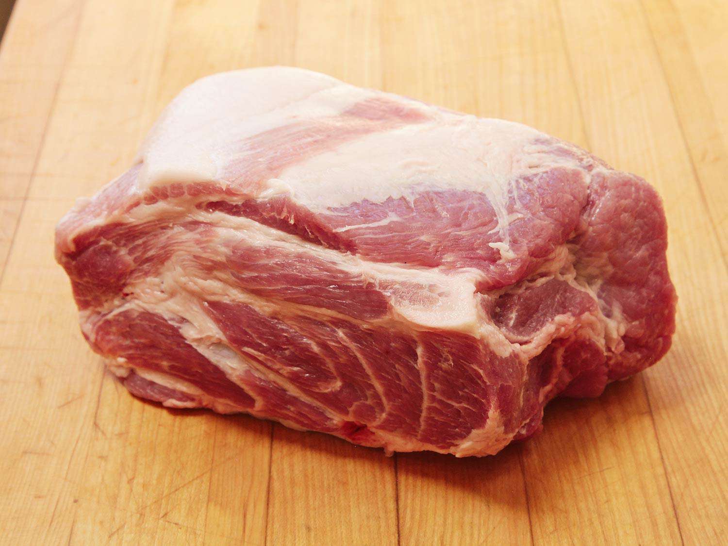 Raw pork shoulder, ready for roasting.