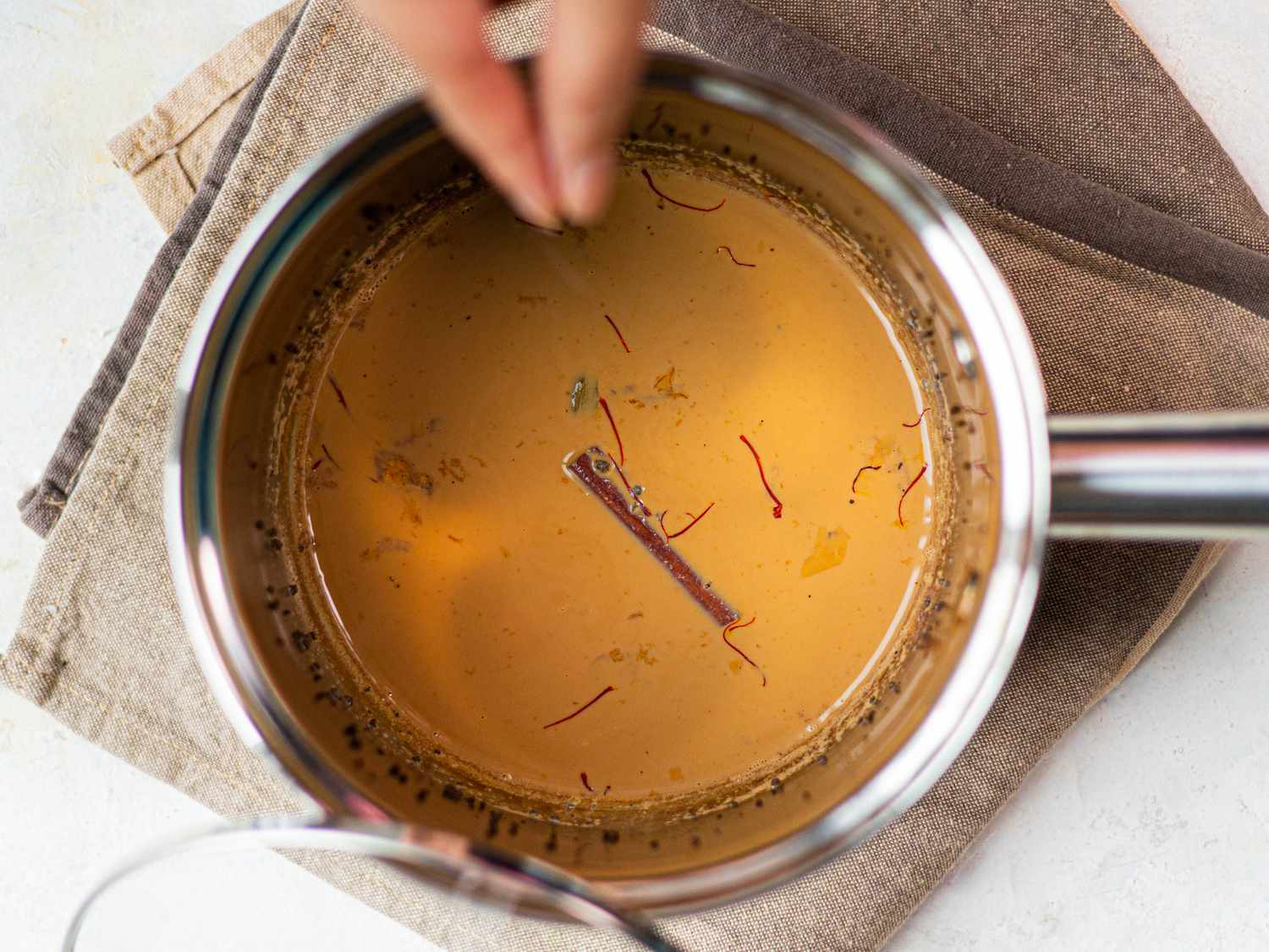 Adding saffron to chai