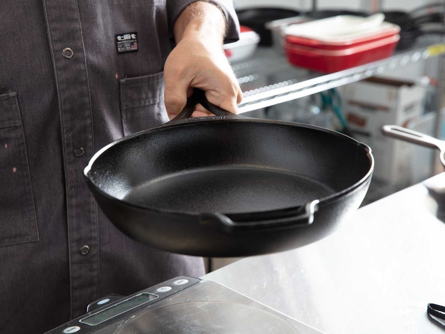 Lodge's Blacklock skillet is lightweight and comfortable to hold, as shown in the hand of the review here.