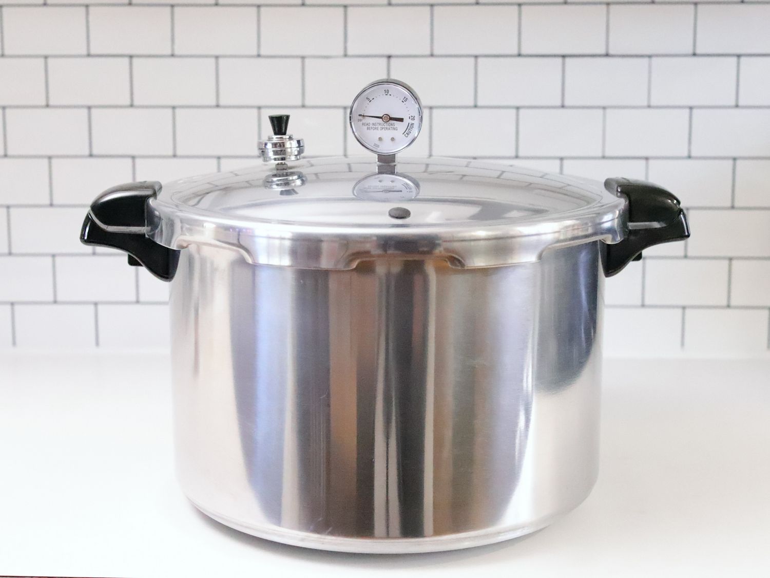 Presto 16-Quart Pressure Canner on a white kitchen countertop