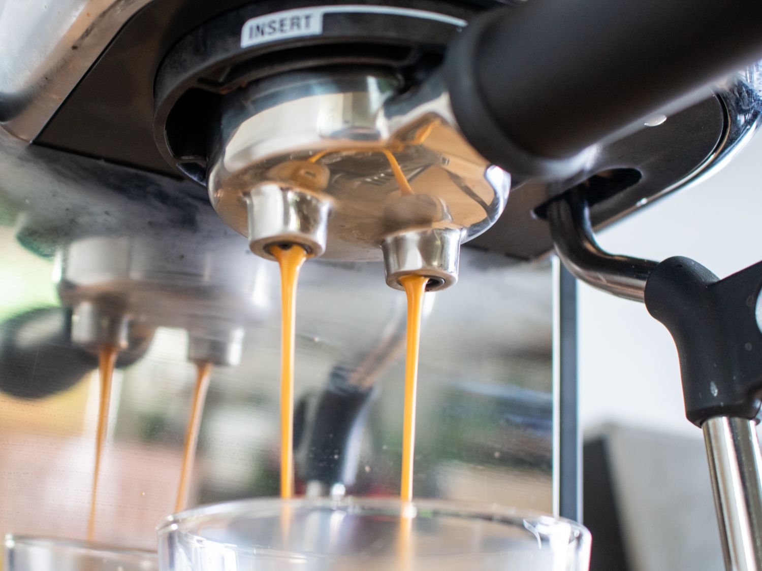 An espresso shot being pulled from the Breville Bambino Plus