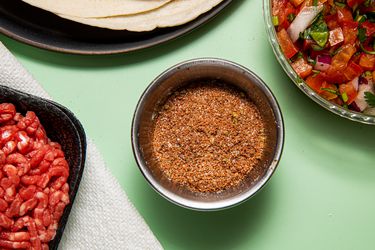 Overhead view of homemade taco seasoning in a small bowl