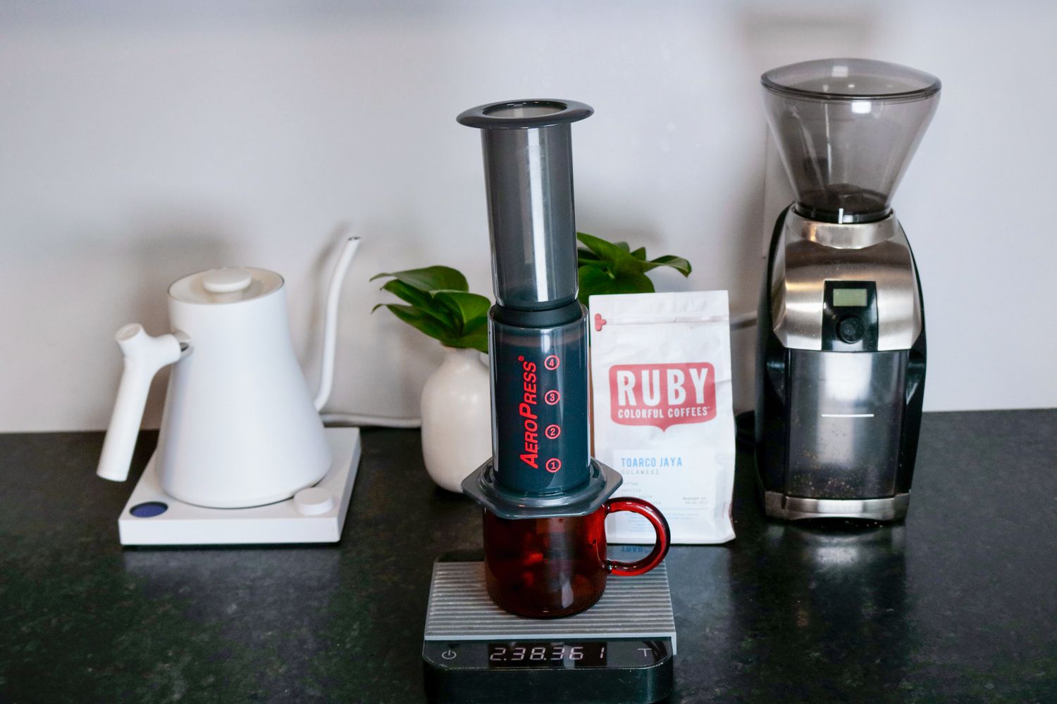 The Aeropress and Fellow Prismo Attachment assembled and sitting on a scale