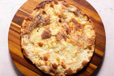 Overhead of a focaccia di Recco on a serving board