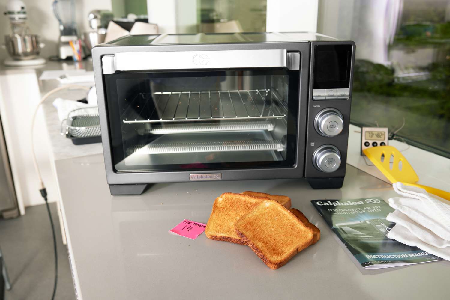 A Calphalon air fryer toaster on on a kitchen countertop