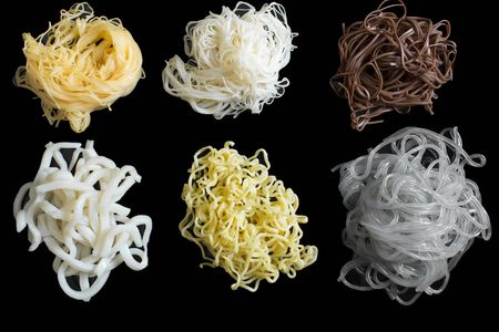 Six different Asian noodle types on a black background