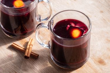 Glogg in two glass mugs on a wooden table