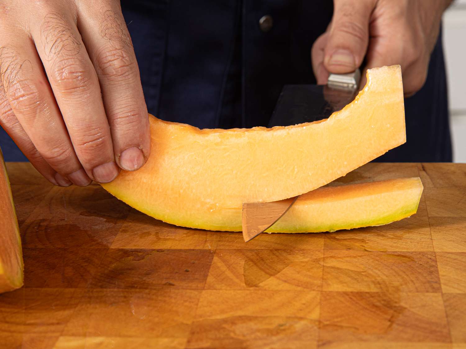 Side view of removing fruit from skin