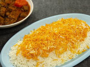 Overhead view of Persian rice on a blue paltter