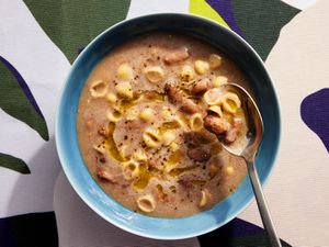 Overhead view of a soup lifting a bite of soup